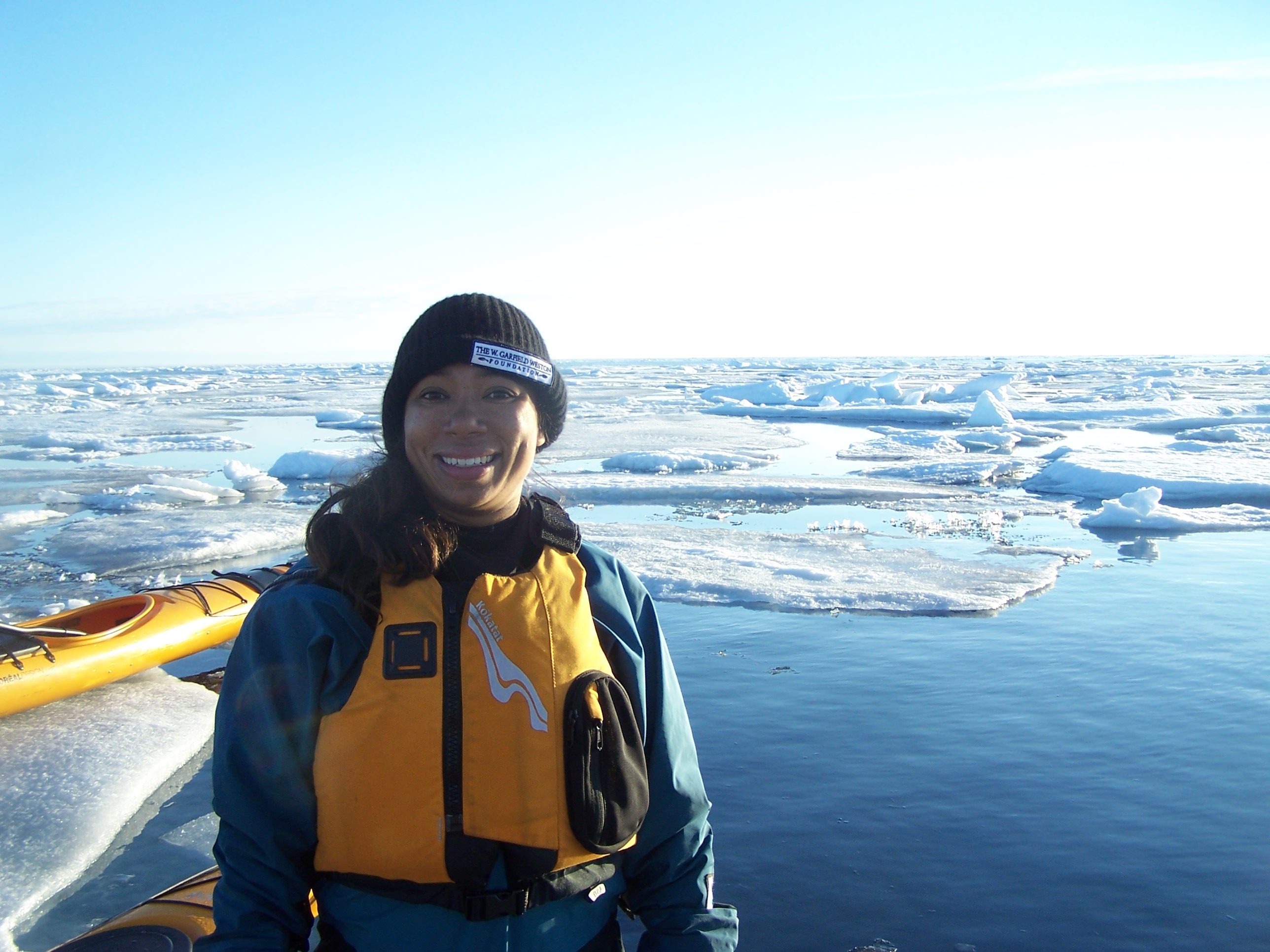 Emily stands in front of some sea ice
