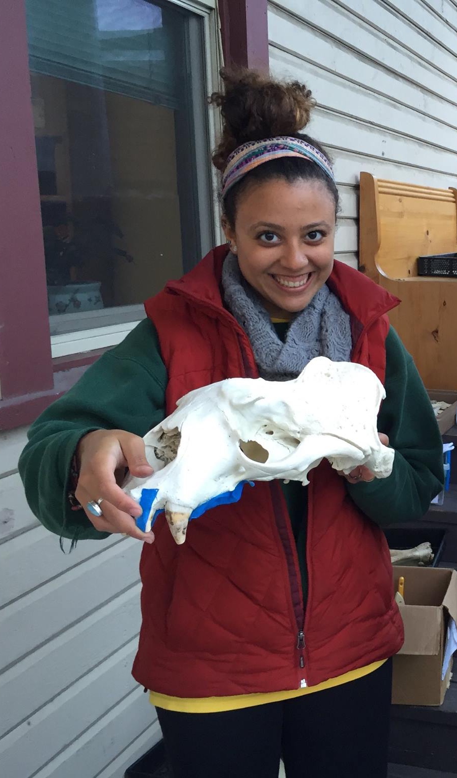 Salma holds a whale skull