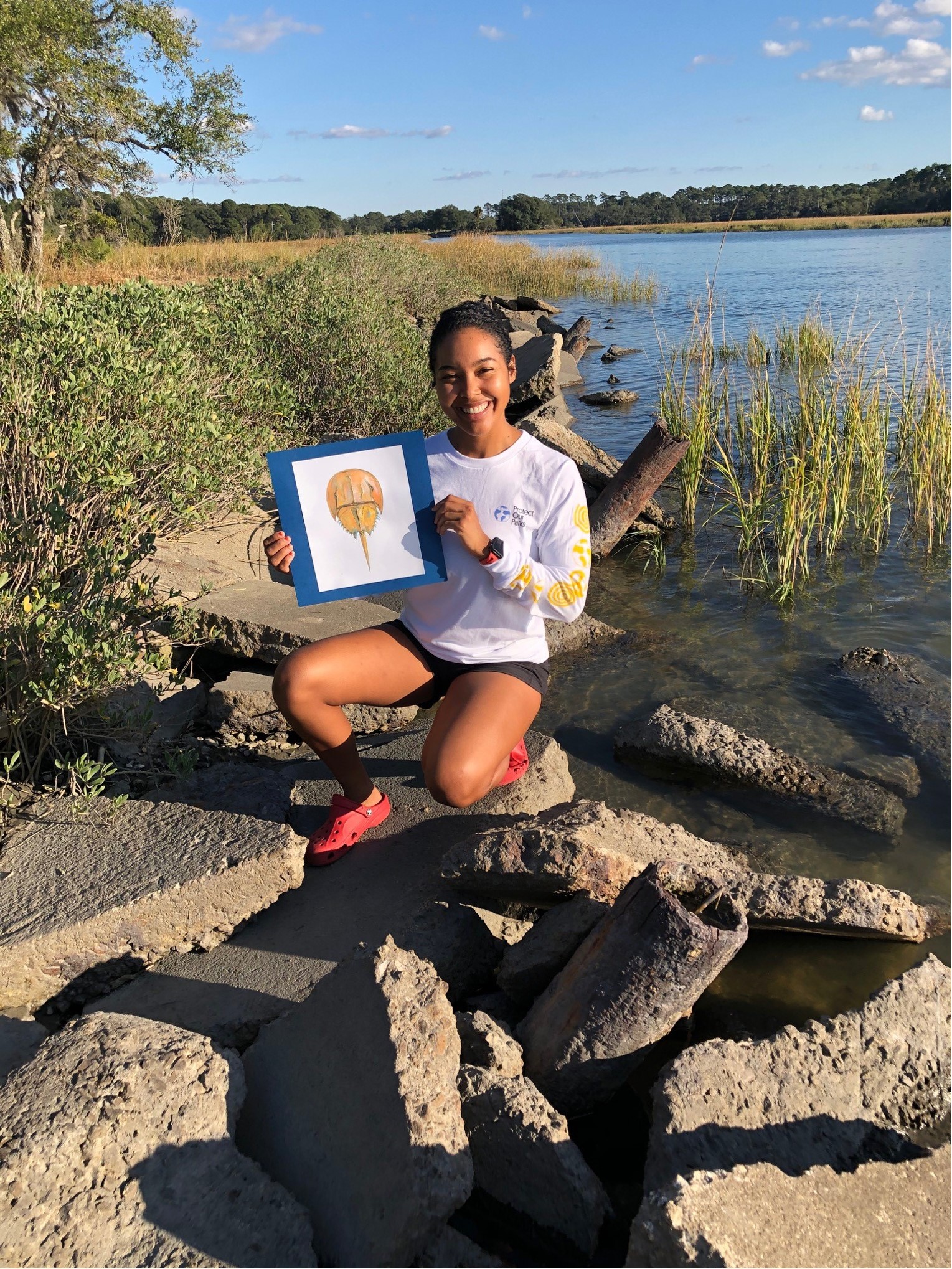 Yessenia by the coast with a sketch of a horseshoe crab